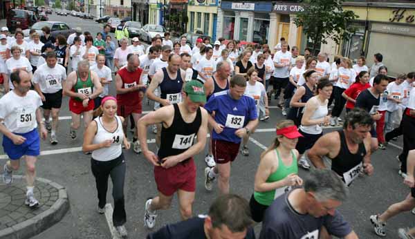 Runners and Walkers in the DeCare International Road Race and Walk in aid of Mayo Cancer Support Association cross the starting line  in Claremorris on Saturday evening last. Photo Michael Donnelly