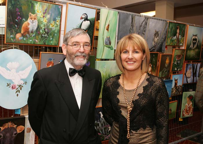 Castlebar Rotarians and organisers Joe Beirne and Vivienne Kyne, Castlebar pictured at the Castlebar Rotary Club Art sale (in conjunction with the Mayo Pink Ribbon Appeal) in Breaffy House Hotel, Castlebar. Photo:  Michael Donnelly