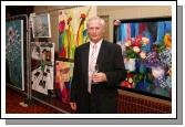 Arnold Wymen pictured with paintings by his wife Ans De Konig at the Castlebar Rotary Club Art sale (in conjunction with the Mayo Pink Ribbon Appeal) in Breaffy House Hotel, Castlebar. Photo:  Michael Donnelly