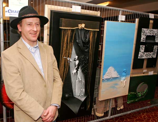 Charlestown Artist Philip Noonan pictured with some of his exhibits at the Castlebar Rotary Club at the Castlebar Rotary Club Art sale (in conjunction with the Mayo Pink Ribbon Appeal) in Breaffy House Hotel, Castlebar. Photo:  Michael Donnelly