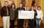 John OShaughnessy, chairman of the Mayo People in Need Committee, (centre) presents a cheque for 22,000 Euros to Jimmy, Mary and Helen Mulryan, Claremorris of Enable Ireland, at the distribution of 163,100 Euros collected in the "Telethon 2004 - People in Need" fundraising in the Welcome Inn Hotel Castlebar, included in photo are People in Need Committee, from left: Michael Larkin, Helen Kenny and Michael Rooney. Photo Michael Donnelly

