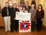 John OShaughnessy, chairman of the Mayo People in Need Committee, presents a cheque for 27,000 to Carmel Monaghan, Irish Wheelchair Association, at the distribution of 163,100 Euros collected in the "Telethon 2004 - People in Need" fundraising in the Welcome Inn Hotel Castlebar, included in photo from left Michael Larkin, John OShaughnessy, Michael Rooney, Carmel Monaghan, Pat Murray, President, Castlebar Chamber of Commerce and Tom Kenny and Helen Kenny. Photo Michael Donnelly