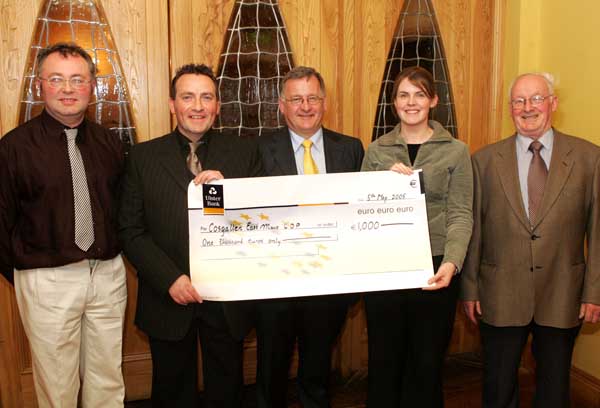 John OShaughnessy, chairman of the Mayo People in Need Committee, presents a cheque for 1,000 Euros to Claire Forrestal, Cosgallen Project Co-ordinator, Charlestown, at the distribution of 163,100 Euros collected in the "Telethon 2004 - People in Need" fundraising in the Welcome Inn Hotel Castlebar, include in photo from left are People in Need Committee: Michael Larkin, John OShaughnessy, John Grant, Claire Forrestal, and Tom Kenny.  Photo Michael Donnelly
