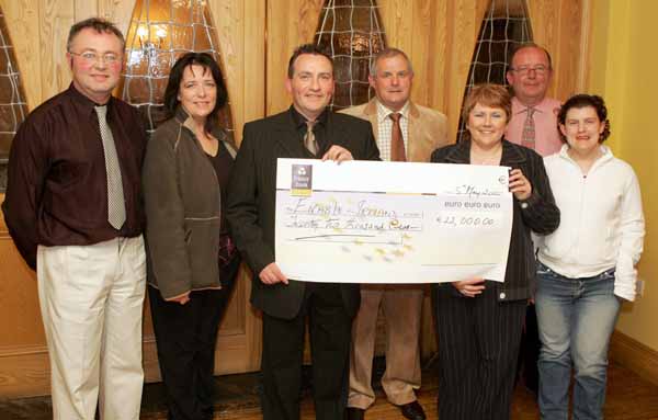 John OShaughnessy, chairman of the Mayo People in Need Committee, (centre) presents a cheque for 22,000 Euros to Jimmy, Mary and Helen Mulryan, Claremorris of Enable Ireland, at the distribution of 163,100 Euros collected in the "Telethon 2004 - People in Need" fundraising in the Welcome Inn Hotel Castlebar, included in photo are People in Need Committee, from left: Michael Larkin, Helen Kenny and Michael Rooney. Photo Michael Donnelly

