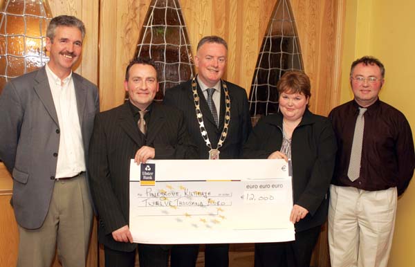Margaret Irwin, Senior House Parent, Pine Grove Kiltimagh is presented with a cheque for 12,000 Euros by John O'Shaughnessy, chairman of the Mayo People in Need Committee, at the distribution of 163,100 Euros collected in the "Telethon 2004 - People in Need" fundraising, in the Welcome Inn Hotel Castlebar, included in photo from left: James Rocke, Western Care, Pat Murray, President Castlebar Chamber of Commerce, and Michael Larkin committee. Photo Michael Donnelly  