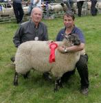 Joe Jordan Bonniconlon  (on right) pictured with his Suffolk Cross Ewe lamb at Ballinrobe Agricultural Show included is Sean Brennan Sheep Judge. Photo: Michael Donnelly.