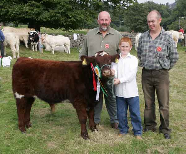 Jason Murphy Crossmolina with the  Reserve Champion  Shorthorn of Show at Ballinrobe Agricultural Show, included in photo are Judges Donie McKeon, Enniscrone, and Michael D'Arcy Oughterard.  Photo: Michael Donnelly.