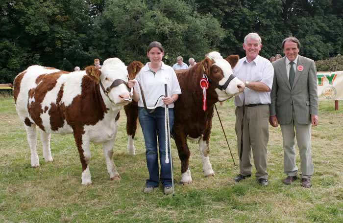 Elaine and Paddy Hennelly, Cregconnell Rosses Point Sligo with the winners in the Simmentals Pairs  Class (sponsored by TJ Heneghan V.S) at Ballinrobe Agricultural Show, "Seepa Pearl" and "Seepa Regina" included in photo is Kenneth Stubbs, Cattle Judge, Irvinestown Co. Fermanagh. Photo: Michael Donnelly.