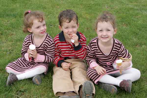 The Duggan Triplets home from Freshmeadows Queens NewYork, pictured enjoying the icecream at Ballinrobe Agricultural show, their parents are Eileen (Gilrane) Ballinrobe and John Duggan Bekan Claremorris. Photo: Michael Donnelly.