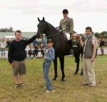 Tiernan Gill Ballina is presented with the Oliver Dixon Gold Cup for Champion Hunter under Saddle at Claremorris Agricultural Show 2005 by Paul Dixon included in photo are Barry Dixon and Olivia Dixon. Photo: Michael Donnelly.