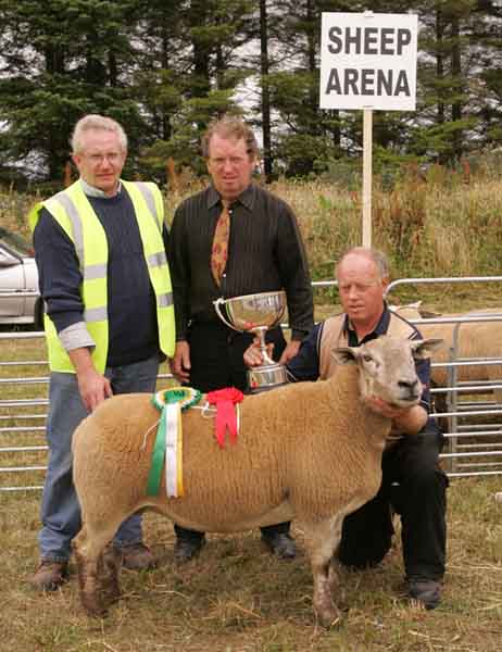 Aidan Fahy,  Ardrahan Co Galway (on right) with the Commercial Champion Crossbred Sheep at Claremorris Agricultural Show, pictured with from left John McWalter show steward  and  P.J. Howard Sheep Judge.  Photo: Michael Donnelly.
