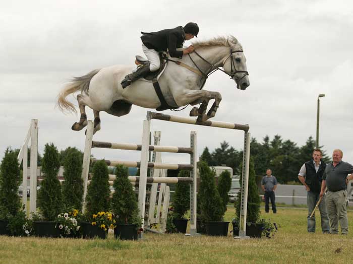 Damien Griffin Ahascragh Ballinasloe on Lissyegan Clover Diamond clears the huge 2 metre Puissance at Claremorris  Agricultural show to win the the competition. Photo: Michael Donnelly. 