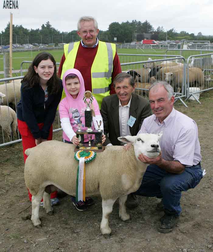Michael Murphy Moneen, Cummer, Tuam (on right) is presented with the Walter Brennan  Perpetual trophy for Overall Champion Sheep at the 88th Claremorris Agricultural Show, included in photo from left: Michelle Murphy, Laura Murphy, John McWalter, Sheep Steward (at back), and Patsy Reilly (Sheep Judge). Photo:  Michael Donnelly