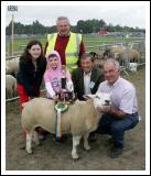 Michael Murphy Moneen, Cummer, Tuam (on right) is presented with the Walter Brennan  Perpetual trophy for Overall Champion Sheep at the 88th Claremorris Agricultural Show, included in photo from left: Michelle Murphy, Laura Murphy, John McWalter, Sheep Steward (at back), and Patsy Reilly (Sheep Judge). Photo:  Michael Donnelly