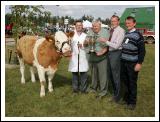 Martin Feeney, Ballygawley, Co Sligo is presented with the Parish Cup by PJ Timlin (steward) Michael Fox, Tullamore, (judge) and Colm Kitching (steward) at the 88th Claremorris Agricultural Show for best Continental X heifer to breed a Continental Calf, (Class 73).   Photo:  Michael Donnelly