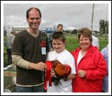 Daragh Sheridan, Tonacrick, Lahardane pictured with his prizewinning Partridge Pekin.  Included in photo are Ian Satchwell, Roscommon (judge), and Eileen Sheridan. Photo:  Michael 