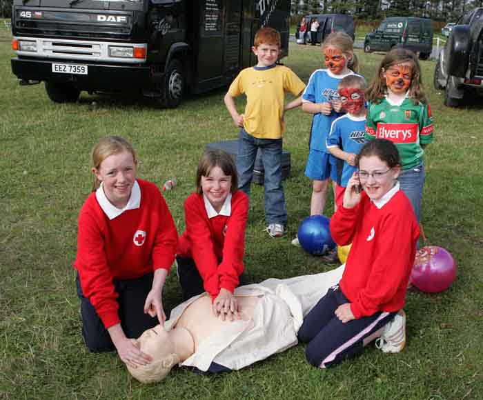 Young members of Claremorris Red Cross Cadets giving a CPR demonstration at the 88th Claremorris Agricultural, from left: Rebeca Cleary, (doing breathing); Dawn Regan, (chest compressions) and   Imelda Clarke, phoning for ambulance; Missing from photo was Evan Stapleton. Photo:  Michael Donnelly
