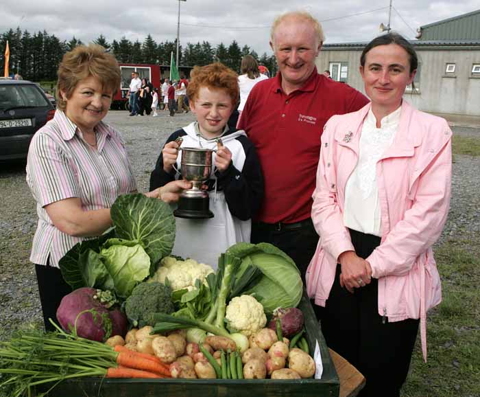 Desmond McLoughlin, Ballyfarna, Claremorris is presented with the Michael Nevin Cup by Mary McTigue  Claremorris Show Committee, for Best selection of Vegetables from the garden at the 88th Claremorris Agricultural Show, included in photo are Michael and Evelyn McLoughlin. Photo:  Michael Donnelly   