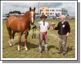 John Joyce (sponsor) presents the Michael Joyce Memorial Cup  (International Show jumper 1992 1998) to Stephen Doherty, Ballina at Claremorris Agricultural Show, for best 3 year Old Gelding or Filly, (Class 5). Photo:  Michael Donnelly