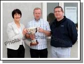 Paul Hunt (sponsor) presents the Martin Waldron Memorial Cup to Maureen Finnerty secretary Claremorris Agricultural Show, on right is Paul Hanley, Show Chairman. Photo:  Michael Donnelly