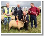Joseph Gilligan  (2nd from left) presents the Gilligan Trophy to Aidan Fahy Ardrahan Galway  for best  Crossbred  Breeding Ewe Lamb at Claremorris Agricultural Show included in photo are John McWalter, Steward (on left) and PJ Howard (Judge) on right. Photo:  Michael Donnelly