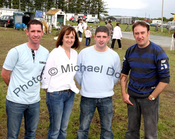 Kenny, Maria and Shane Fahy and Fr Peter Gannon, take a breather after their long afternoon performance on stage at Claremorris Agricultural Show 