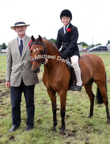 Cormac Hanley, Claremorris was the winnner of the U-12 ridden Class at Claremorris Agricultural Show pictured with judge Pascal Crawford. Photo:  Michael Donnelly