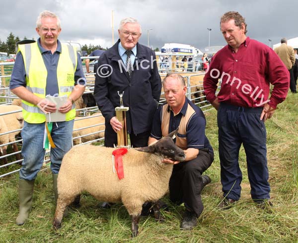 Joseph Gilligan  (2nd from left) presents the Gilligan Trophy to Aidan Fahy Ardrahan Galway  for best  Crossbred  Breeding Ewe Lamb at Claremorris Agricultural Show included in photo are John McWalter, Steward (on left) and PJ Howard (Judge) on right. Photo:  Michael Donnelly