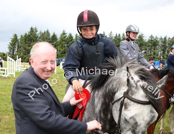 Cormac Hanley on Emerald Pride winner of the 138 ABC is presented with his rosette by Bernie McKenna Castlebar at Claremorris Agricultural Show.Photo:  Michael Donnelly