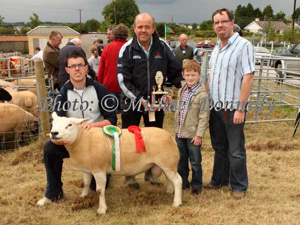 Eoin Prendergast and Ger McLoughlin presenting the McLoughlin Perpetual Trophy  for Champion Sheep of Claremorris Show to Liam and David (on left) Coen, Hollymount. Photo: Michael Donnelly.