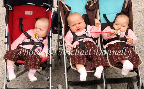 The McDonnell triplets Claremorris from left Katie, Rebecca and Laura were busy watching all around at the Claremorris Agricultural Show.Photo: Michael Donnelly.