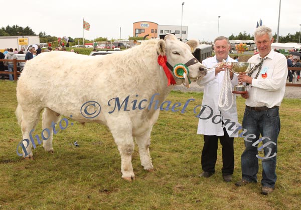 Robert Burns, Easkey, Co Sligo is presented with the Martin Waldron Memorial  Cup for Commercial Cattle Champion of Show by Joe Hallinan, Quin Co Clare (judge) at Claremorris Agricultural Show.Photo: Michael Donnelly.