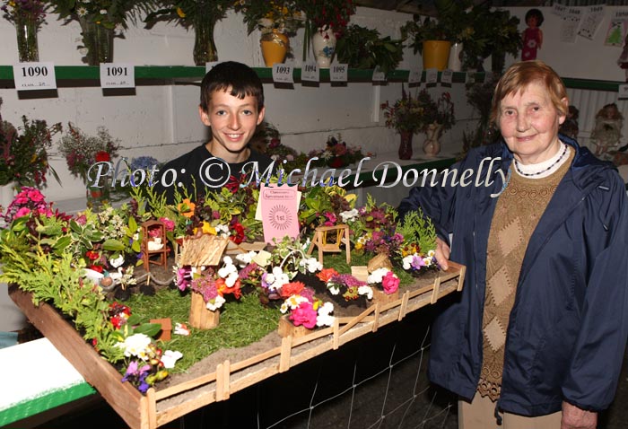 Jarlath Bell, Hollymount pictured at Claremorris Agricultural Show with his grandmother Birdie Bell, and his prizewinng "imaginative presentation of a garden on a tray or board not exceeding 30 x 20 inches using rock, bog or any other novel background" Photo:  Michael Donnelly 