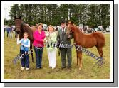 Pauline Prendergast (2nd from left), sponsor, presents the Eileen Prendergast Memorial Cup for Best Colt or Filly Foal to Aine O'Malley, Ballinrobe, included in photo are Grainne and Billy O'Malley.Photo: Michael Donnelly.