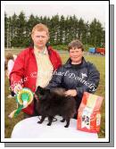 Sandra Mullarkey, with "Blackie"  a black Pomeranian, Champion Dog of Show at Claremorris Agricultural Show and Michael Mullins Lecarrow Co Roscommon (Judge). Photo: Michael Donnelly.