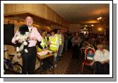 Auctioneer  Matt Duggan Swinford pictured with  a stuffed Dog, one of the many items at the 24 Hour Auction in Julians of Midfield Swinford in an attempt to break a record in the Guinness book of Records. The Auction continues until 6pm Sunday 14th.  Photo:  Michael Donnelly