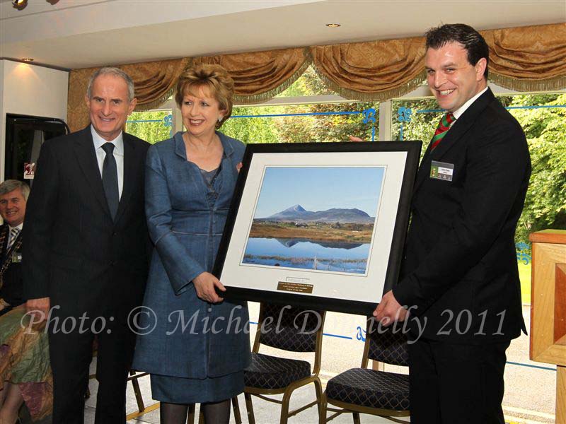 Sean Reid, Chairman Mayo Associations Worldwide Convention 2011 committee makes a presentation to President Mary McAleese and Dr Martin McAleese after she performed the official opening of the Convention in Hotel Westport, Westport. Photo: © Michael Donnelly 2011