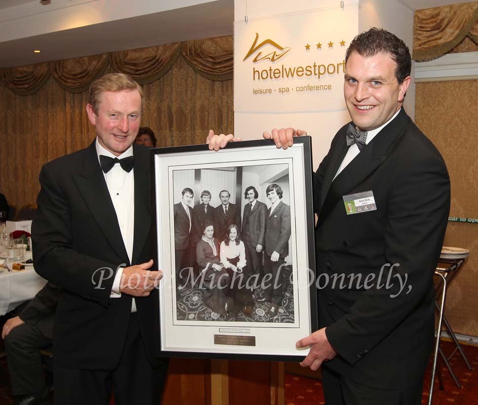Special Guest at Mayo Associations Worldwide Convention 2011 Gala Dinner - Taoiseach Enda Kenny, T.D., is presented with a framed family photo from 1973 by Sean Reid, Chairman Mayo Associations Worldwide Convention 2011 committee in Hotel Westport, Westport. Photo: © Michael Donnelly 2011
