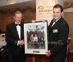 Special Guest at Mayo Associations Worldwide Convention 2011 Gala Dinner - Taoiseach Enda Kenny, T.D., is presented with a framed family photo from 1973 by Sean Reid, Chairman Mayo Associations Worldwide Convention 2011 committee in Hotel Westport, Westport. Photo: © Michael Donnelly 2011