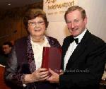 Teresa Downes of Mayo Association Galway makes a presetation of Knox's History of Mayo  by De Búrca Rare Books to Guest of Honour An Taoiseach Enda Kenny  at the Mayo Associations World Convention  Gala Dinner at Hotel Westport, Westport. Photo:Michael Donnelly