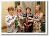 Castlebar ladies pictured with the Cup at the Castlebar Mitchels Ladies Football Club Fashion Show in the Failte Suite, Welcome Inn Hotel, Castlebar, from left: Bernadette Daniel, Brid Healy, Breege Ormsby and Orla Hughes. Photo:  Michael Donnelly