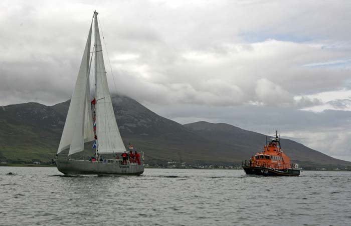 The Northabout and crew sail past Croagh Patrick (The Reek) on their way into Westport harbour after completing their historic voyage around the Artic Ice cap. She is escorted by the Achill lifeboat RNLB "Sam and Ada Moody".  Photo: Michael Donnelly.