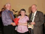 Paddy Walsh, Kilmaine makes a presentation to Mary and Cecil Jackson Ballycastle (chairman of the Mayo North Old Engine and Tractor Club) at the Threshing Social in the Dalton Inn Hotel Claremorris.  Photo: Michael Donnelly.