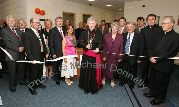 Archbishop of Tuam, Most Rev Dr Michael Neary D.D. cuts the tape at the official opening and Blessing of CBE's new Head Office and Research and Development Centre IDA Business Park Claremorris, included in photo from left: Sean  Neachtain MEP; Seamus Bree, Regional Director, Enterprise Ireland; Sean Kenna CBE; Carmel Murray, Gerry and Catherine Concannon; Archbishop Michael Neary,  Myra and Joe Concannon, and at back right Seamus Murray Cathal Concannon, Fr Peter Gannon and Monsignor Cathal Brennan, who travelled from Portland Oregon USA. Photo:  Michael Donnelly