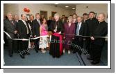 Archbishop of Tuam, Most Rev Dr Michael Neary D.D. cuts the tape at the official opening and Blessing of CBE's new Head Office and Research and Development Centre IDA Business Park Claremorris, included in photo from left: Sean  Neachtain MEP; Seamus Bree, Regional Director, Enterprise Ireland; Sean Kenna CBE; Carmel Murray, Gerry and Catherine Concannon; Archbishop Michael Neary,  Myra and Joe Concannon, and at back right Seamus Murray Cathal Concannon, Fr Peter Gannon and Monsignor Cathal Brennan, who travelled from Portland Oregon USA. Photo:  Michael Donnelly
