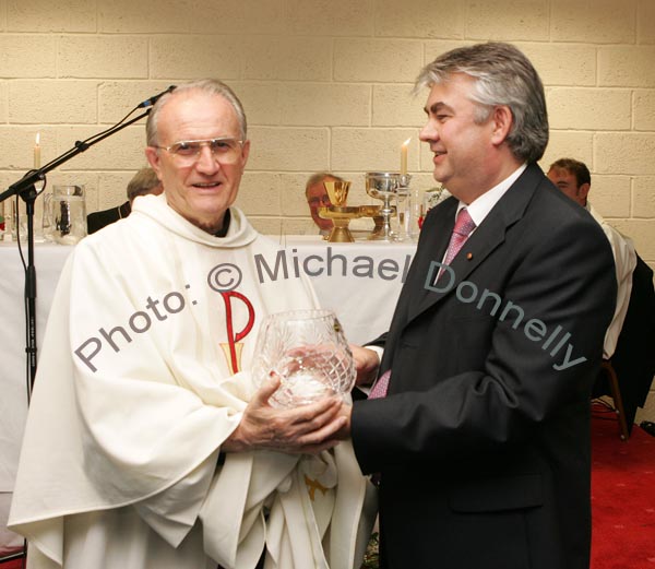 Gerry Concannon, CEO and Chairman of CBE makes a presentation to his uncle Monsignor Cathal Brennan, (who travelled 6,000 miles from Portland Oregan USA) at the official opening of CBE's new Head Office and Research and Development Centre in the IDA Business Park, Claremorris. Photo:  Michael Donnelly