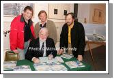 Northabout skipper Jarlath Cunnane pictured as he signs his book Northabout (sailing the North East and North West Passages) in the Linenhall Arts Centre Castlebar, included in photo are Rory Casey, Castlebar, Michael Brogan, Ballyhaunis and Jamie Young, The Killary, Co Galway who all sailed on Northabout  In background is a photo from the the expedition. Photo:  Michael Donnelly