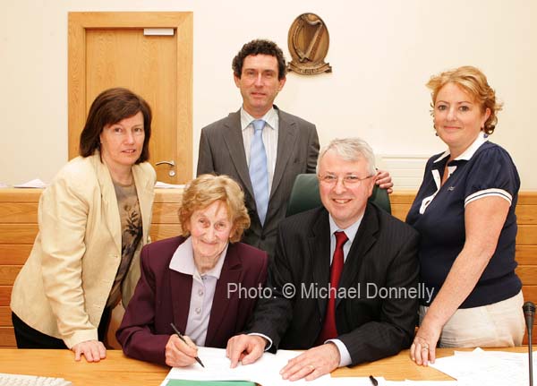 Bridie McHale, Castlebar, proposer for Independent General Election Candidate Dr Jerry Cowley, signs the nomination papers in the Court House Castlebar pictured with Returning Officer Fintan Murphy and at back from left: Marie Quinn, Assistant Returning Officer, Dr Jerry Cowley and Teresa Cowley. Photo:  Michael Donnelly