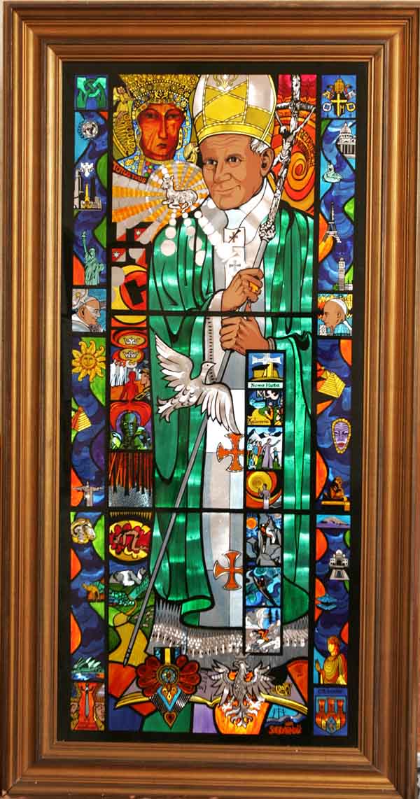 A Unique Kinetic Stained Glass Icon, created by Artist Des Cryan which recalls the Pope's youthful life and his extensive travels around the world and  donated to Ballintubber Abbey, as a celebration of Pope John Pauls life and papacy hangs on the back wall (North Door). Photo: Michael Donnelly