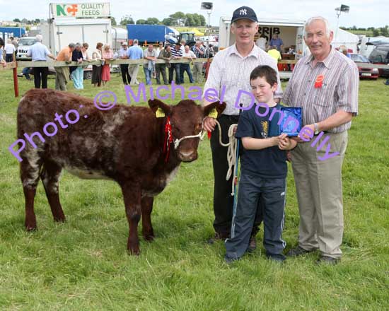 Noel Dowd Creggs Roscommon won the Champion Shorthorn class at Roundfort Agricultural Show, accepting the plaque from Owen O'Neill Bova AI Limerick (Judge) is Cillian O'Donoghue. Photo Michael Donnelly